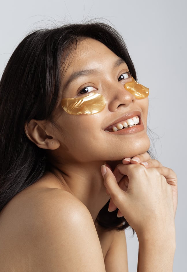 Portrait of Smiling Woman with Under-Eye Patches Gel 